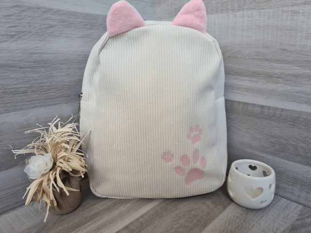 Sac à dos enfant beige pattes rose