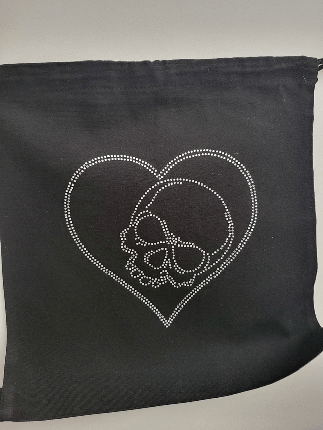 Sac noir avec lien coulissant avec dessin en strass